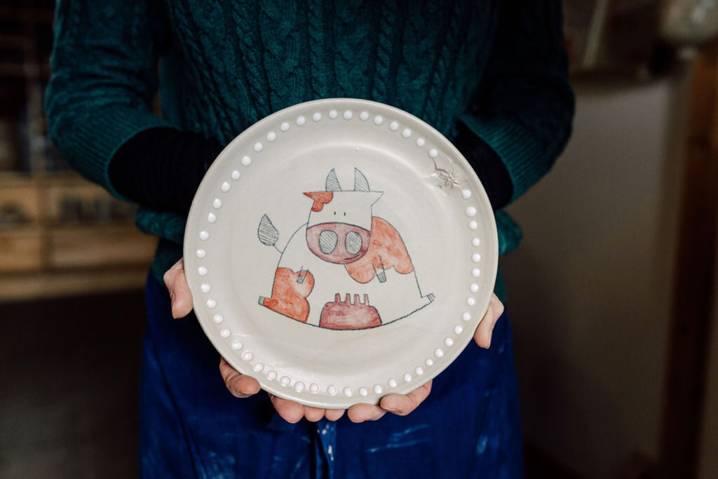 Cow drawing on a handmade pottery plate