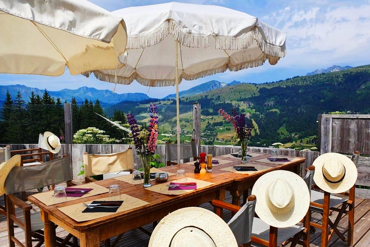 La Paika restaurant terrace with Alpine views in summer