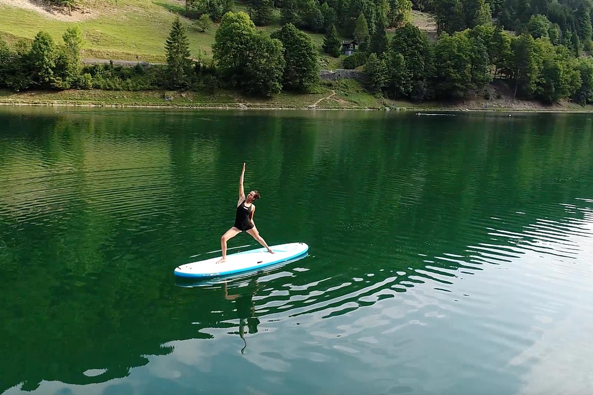 Sup paddle yoga at Lake Montriond in Morzine, French Alps