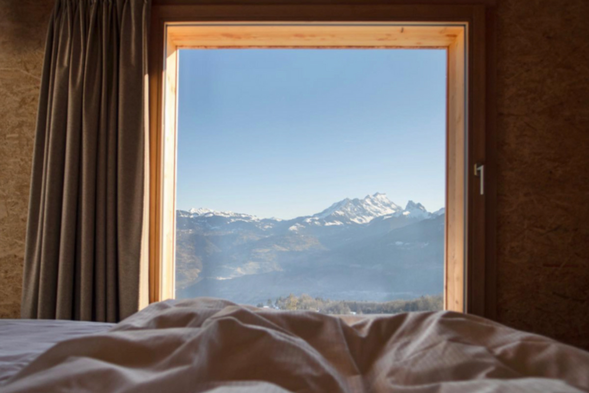 Hotel bedroom with mountain views in Switzerland