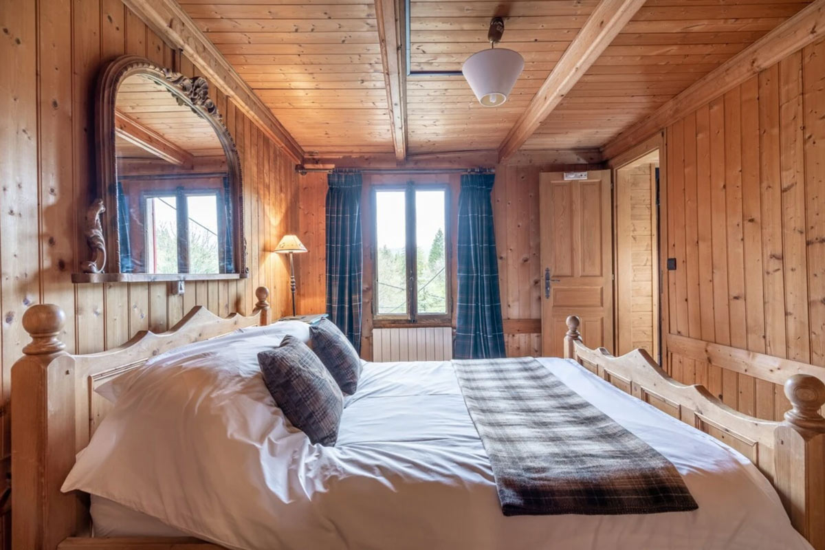 Traditional Alpine bedroom in Chalet Sixtine near Annecy, French Alps