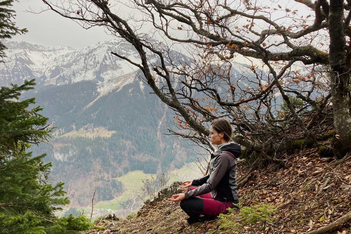Yoga teacher Audrey Cruz Mermy meditating on a retreat in the French Alps