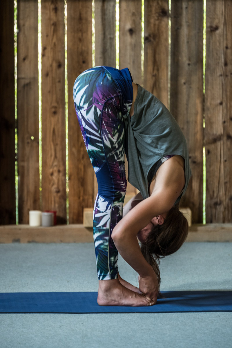 Anais Ricco practicing yoga in her yoga retreat studio in Samoens