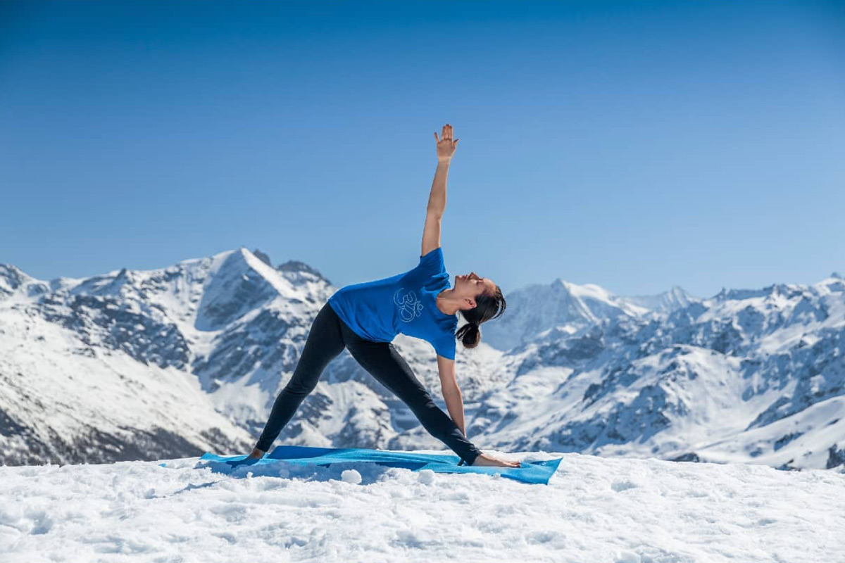 Claudia Lamas Cornejo practising Iyengar yoga in the snowy mountains of the Alps