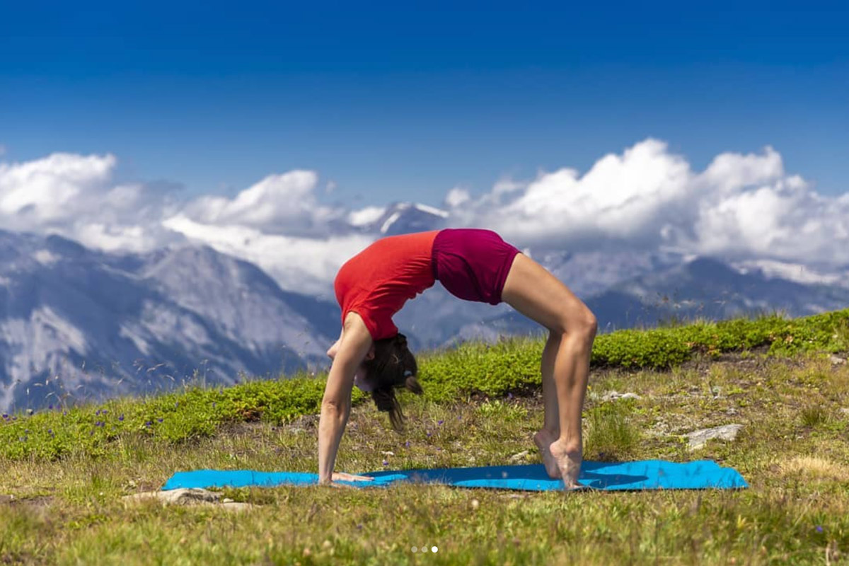 Claudia Lamas Cornejo practising yoga in the Swiss Alps in Summer