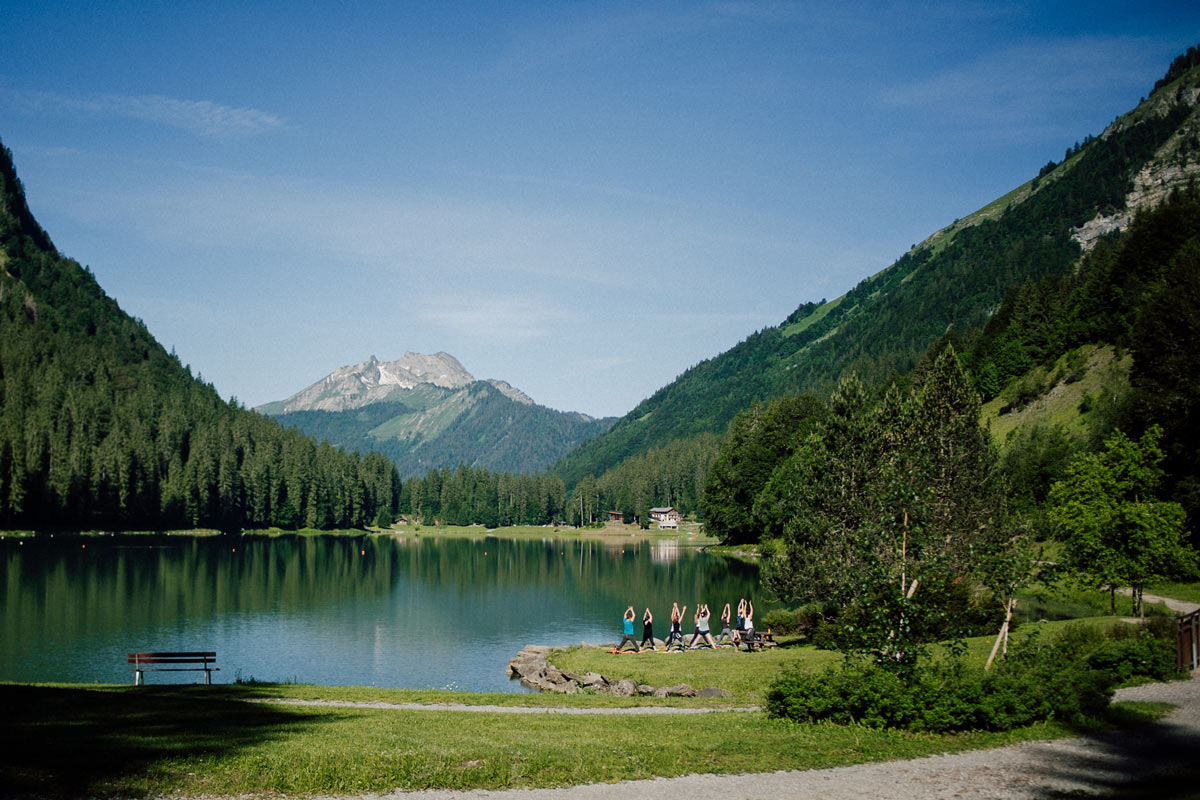 Yoga in front of lake Montriond in the French Alps
