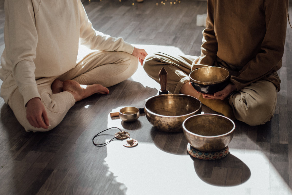 Tibetan bowls being used for sound bath in a yoga nidra session in Samoens