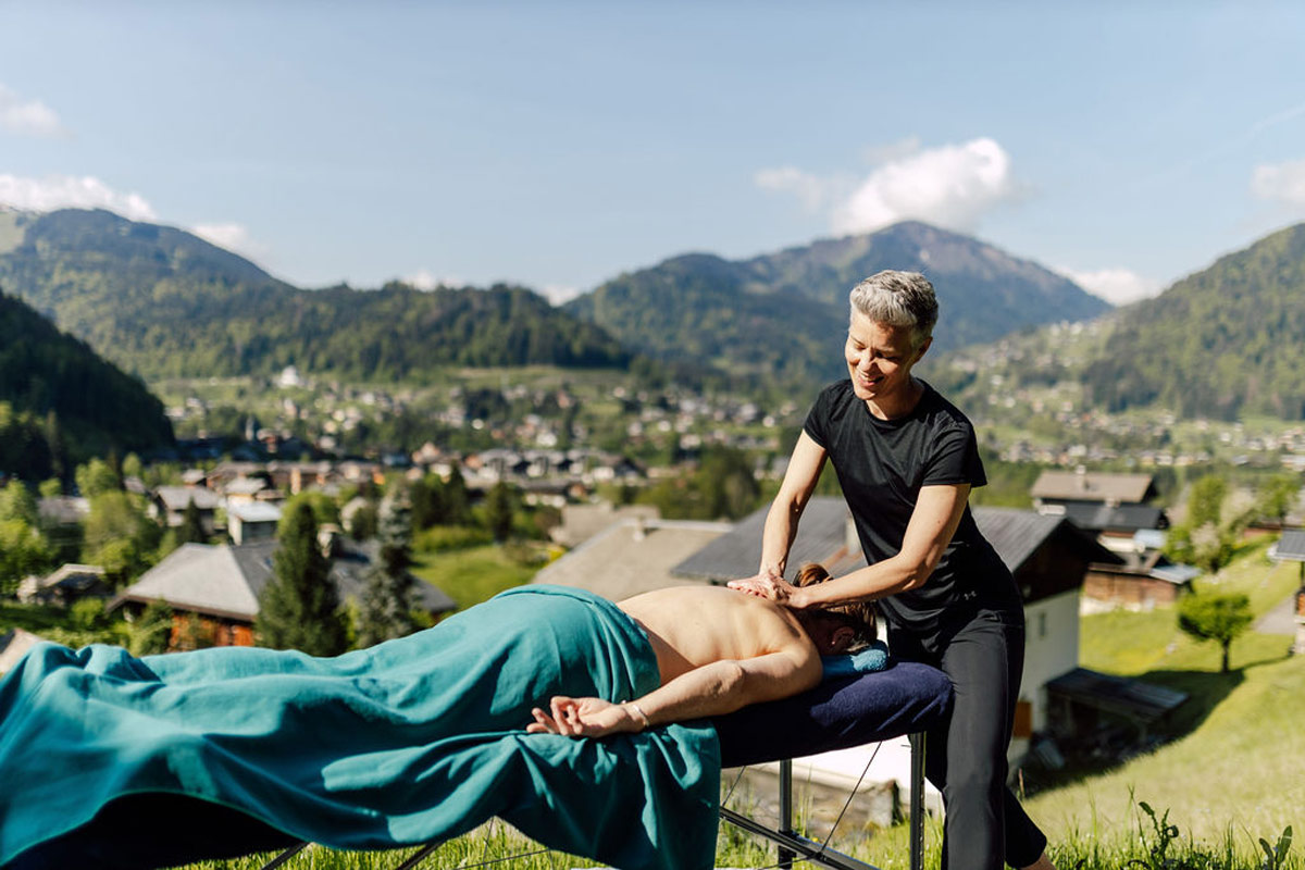 Kristina from Alpine Body Care Massage giving a deep tissue massage outside in the mountains