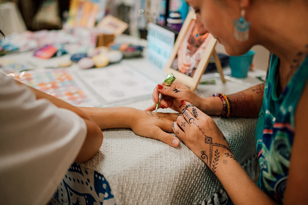 Henna tattoos at yogi market at La Clusaz Yoga Festival in the Haute Savoie
